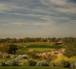 No. 16 is a long, downhill par-3 to a green protected by water at the Raptor course at Grayhawk Golf Club in Scottsdale, Arizona.