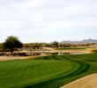 The 18th hole on the Cholla course at We-Ko-Pa Golf Club is a long, downhill par 4 that is guarded by water. 