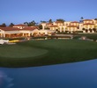 The golf course at Arizona Grand starts from an island tee box beside the hotel.