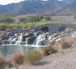 Raven Golf Club's showy waterfall is visible on both the first and 18th holes