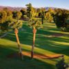 A sunset view of green with narrow road on the left at Wigwam Resort - Heritage Course