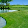 A view of a hole with water on the left side at Apache Creek Golf Club